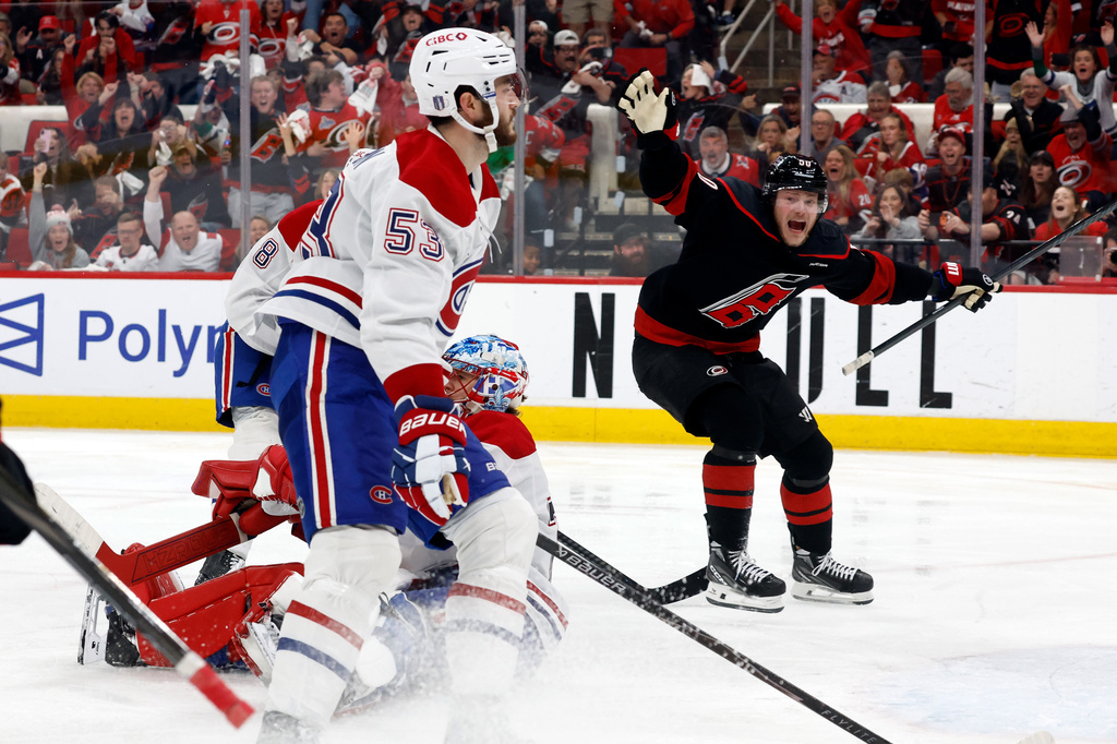 Carolina Hurricanes' Eric Robinson (50) reacts to the game wining overtime goal by Nikolaj Ehlers during overtime in Game 2 of the Eastern Conference final NHL hockey Stanley Cup playoff series in Raleigh, N.C., Saturday, May 23, 2026. (AP Photo/Karl DeBlaker)