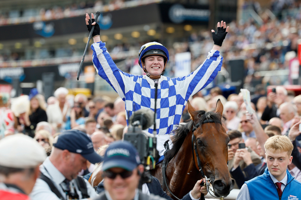 Saffie Osborne celebrates after winning the Betfred St Leger Stakes on day three of the Betfred St Leger Festival at Doncaster Racecourse in Doncaster, England, Saturday, Sept. 12, 2026. (Richard Sellers/PA via AP)