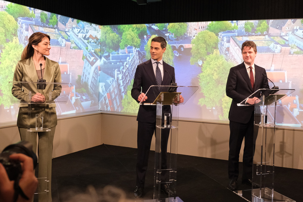 From left, Dutch coalition partners Dilan Yeşilgöz-Zegerius of the People's Party for Freedom and Democracy, Rob Jetten of the centrist D66 and Henri Bontenbal of the right-leaning Christian Democrats speak to reporters as they present a coalition deal in The Hague, Netherlands, on Friday, Jan. 30, 2026. (AP Photo/Mike Corder)