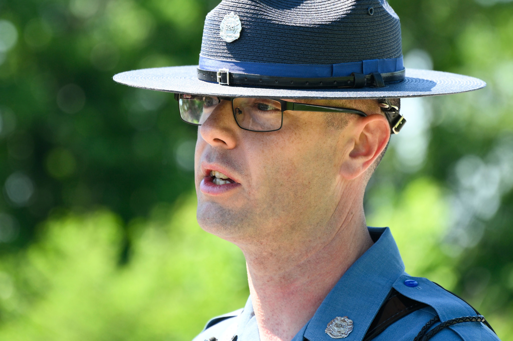 Missouri State Highway Patrol Sergeant Justin Ewing talks to the media about the plane crash at Butler Memorial Airport, in Butler, Mo., Sunday, June 14, 2026. (AP Photo/Reed Hoffmann)