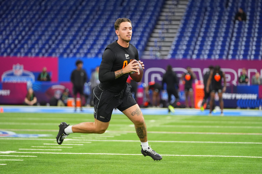 FILE - Miami quarterback Carson Beck (04) runs a drill at the NFL football scouting combine in Indianapolis, Saturday, Feb. 28, 2026. (AP Photo/Julio Cortez, File)