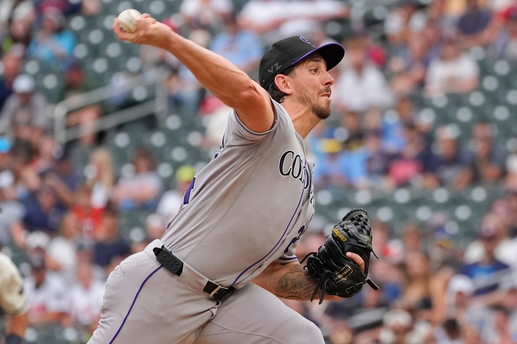 Colorado Rockies starting pitcher Michael Lorenzen throws to the Minnesota Twins in the first inning of a baseball game Saturday, June 27, 2026, in Minneapolis. (AP Photo/Bruce Kluckhohn)