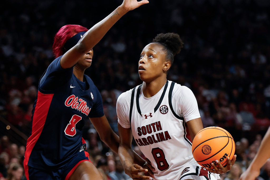 South Carolina forward Joyce Edwards (8) drives to the basket against Mississippi forward Latasha Lattimore during the first half of an NCAA college basketball game in Columbia, S.C., Sunday, Feb. 22, 2026. (AP Photo/Nell Redmond)