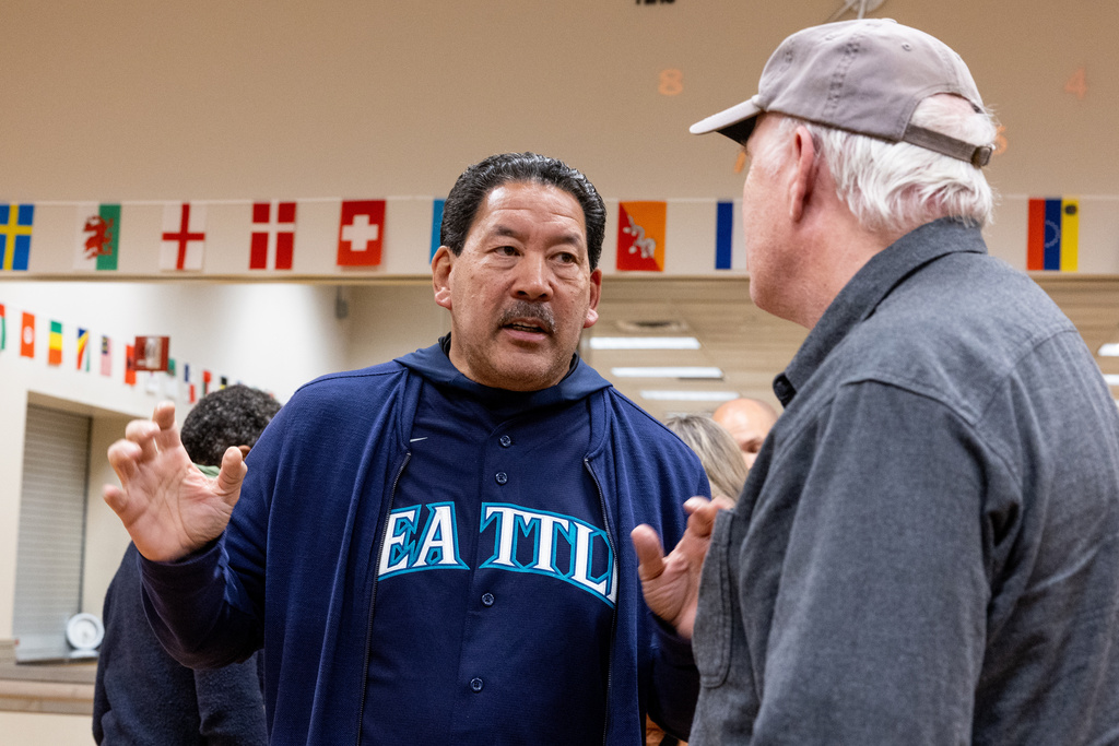 Seattle Mayor Bruce Harrell speaks with attendees after a climate forum Thursday, Oct. 16, 2025, in Seattle. (AP Photo/Maddy Grassy)