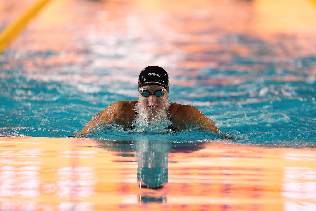 Kate Douglass, of the United States, competes in the women's 100 meters breaststroke final at the Pan Pacific Swimming Championships Thursday, Aug. 13, 2026 in Irvine, Calif. (AP Photo/Gregory Bull)