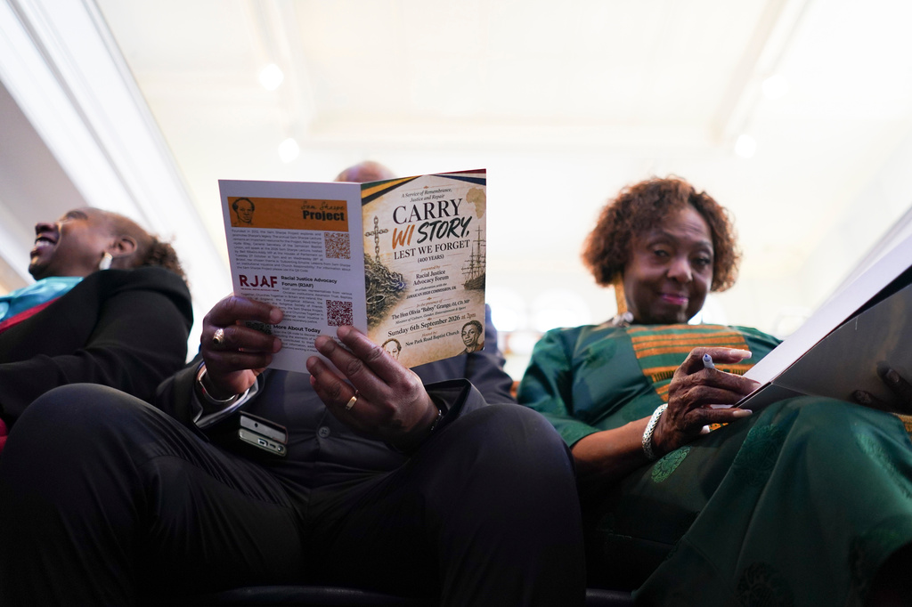 Jamaica's Minister of Culture, Gender, Entertainment and Sport, Olivia Grange, right, attends a service, in London, Sunday, Sept. 6, 2026, for the "remembrance, justice and repair" before filing a petition to refer three specific questions about trans-Atlantic slavery to the Judicial Committee of the Privy Council. (AP Photo/Alberto Pezzali)