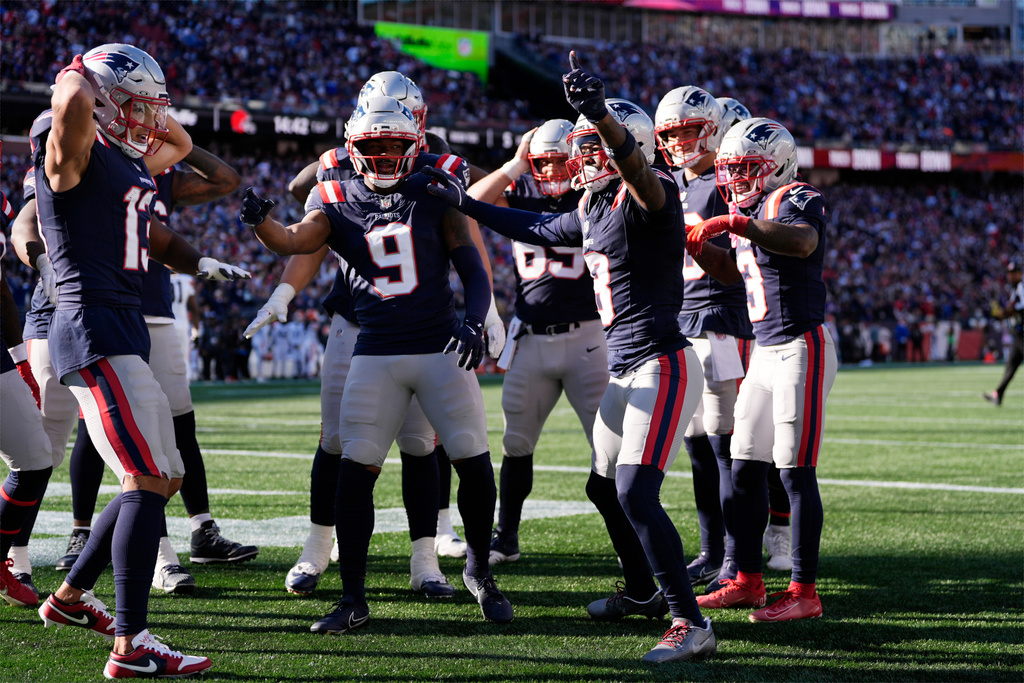 New England Patriots' Kayshon Boutte (9) joins wide receiver Stefon Diggs (8) as Diggs celebrates after scoring a touchdown against the Cleveland Browns in the second half of an NFL football game on Sunday, Oct. 26, 2025, in Foxborough, Mass. (AP Photo/Charles Krupa)