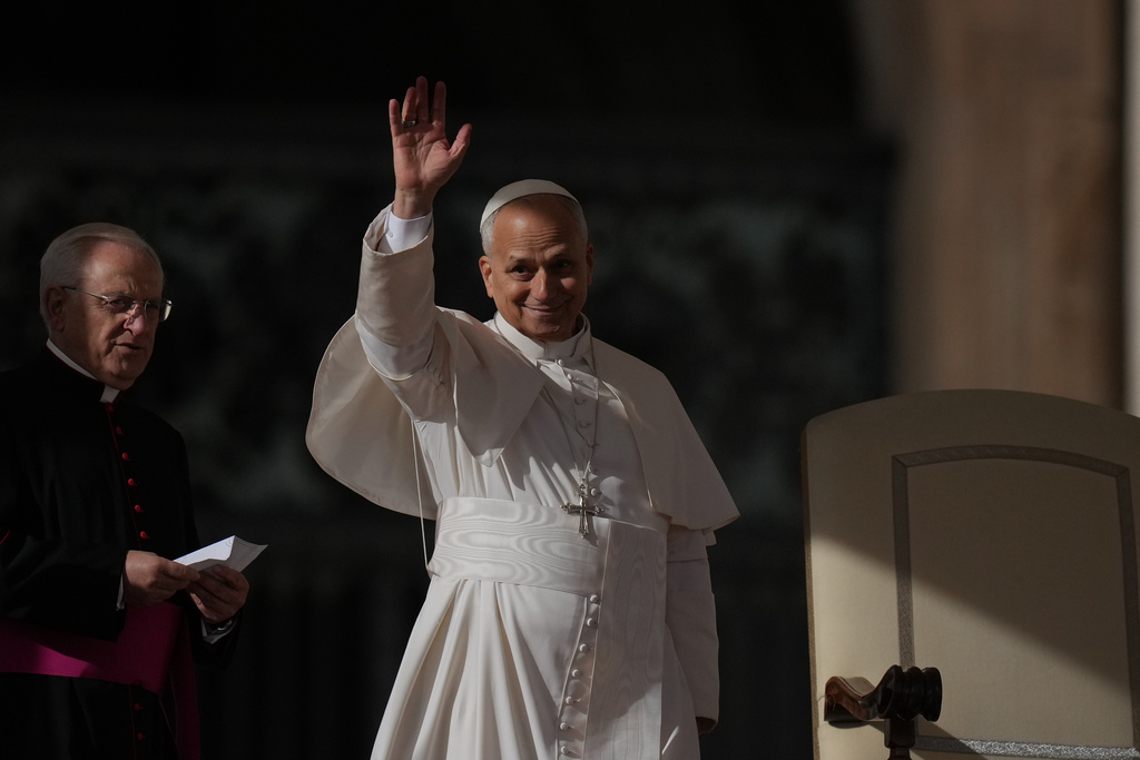 Pope Leo XIV waves as he leaves at the end of an audience on the occasion of the Jubilee of the Choirs in St. Peter's Square, at the Vatican, Saturday, Nov. 22, 2025. (AP Photo/Alessandra Tarantino)