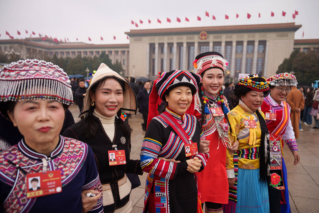 FILE - Ethnic minority delegates arrive to attend the opening session of the Chinese People's Political Consultative Conference (CPPCC) at the Great Hall of the People , China, Wednesday, March 4, 2026. (AP Photo/Vincent Thian, File)
