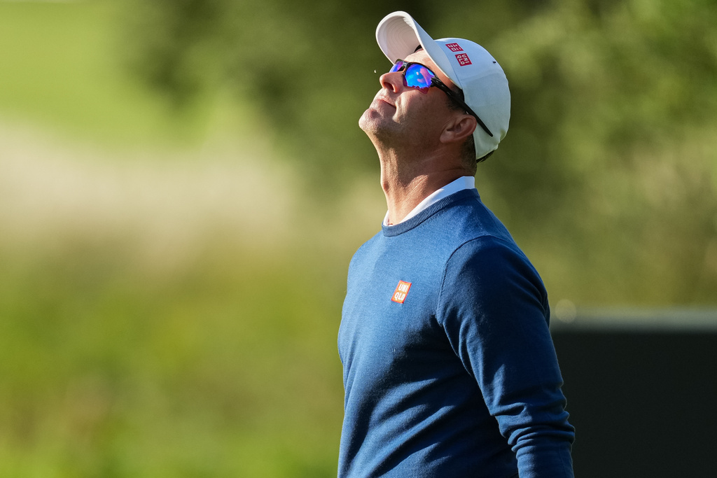 Adam Scott, of Australia, reacts after missing a putt on the 10th hole during the first round of the Australian Open golf tournament in Melbourne, Australia, Thursday, Dec. 4, 2025. (AP Photo/Asanka Brendon Ratnayake)