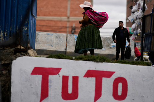 A woman walks past a mural promoting presidential candidate Jorge "Tuto" Quiroga ahead of the runoff election, in El Alto, Bolivia, Thursday, Oct. 16, 2025. (AP Photo/Natacha Pisarenko) A woman walks past a mural promoting presidential candidate Jorge "Tuto" Quiroga ahead of the runoff election, in El Alto, Bolivia, Thursday, Oct. 16, 2025. (AP Photo/Natacha Pisarenko)