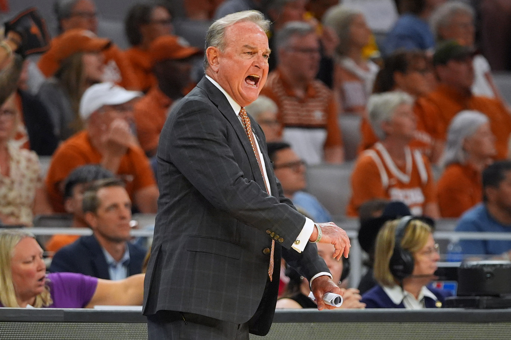 Texas head coach Vic Schaefer watches against Michigan during the first half in the Elite Eight of the NCAA college basketball tournament, Monday, March 30, 2026, in Fort Worth, Texas. (AP Photo/LM Otero)