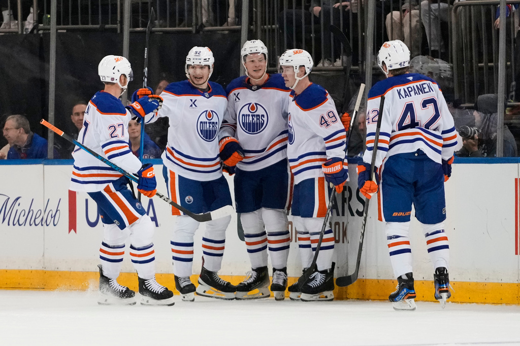 The Edmonton Oilers celebrate a goal by Trent Frederic, center, during the second period of an NHL hockey game against the New York Rangers Tuesday, Oct. 14, 2025, in New York. (AP Photo/Frank Franklin II)