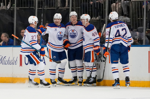 The Edmonton Oilers celebrate a goal by Trent Frederic, center, during the second period of an NHL hockey game against the New York Rangers Tuesday, Oct. 14, 2025, in New York. (AP Photo/Frank Franklin II) The Edmonton Oilers celebrate a goal by Trent Frederic, center, during the second period of an NHL hockey game against the New York Rangers Tuesday, Oct. 14, 2025, in New York. (AP Photo/Frank Franklin II)