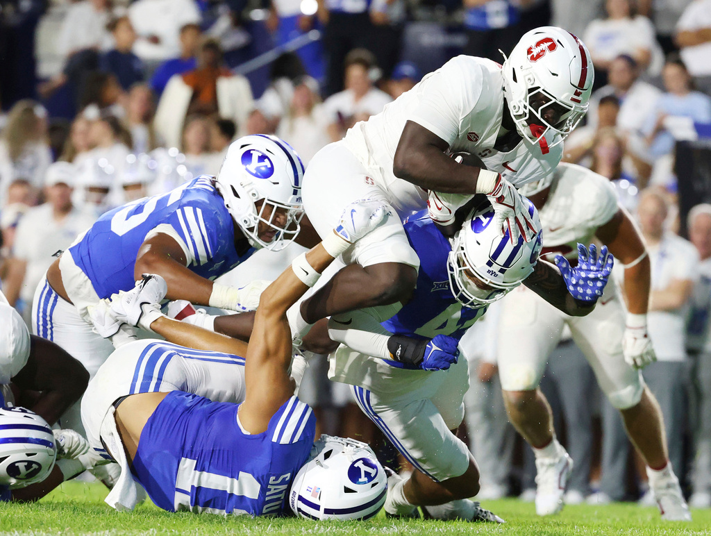 Stanford running back Tuna Altahir runs over the BYU defense during the second half of an NCAA college football game Saturday Sept. 6, 2025, in Provo, Utah. (AP Photo/Jeffrey D. Allred)