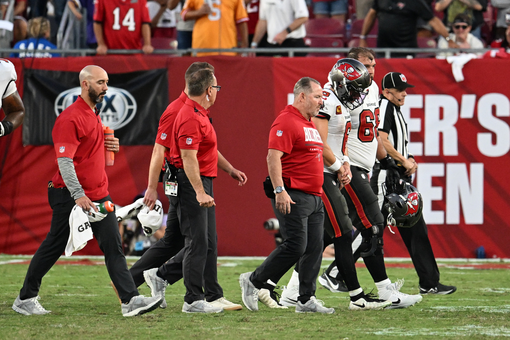 Tampa Bay Buccaneers quarterback Baker Mayfield (6) walks off the field after sustaining an injury during the second half of an NFL football game against the Minnesota Vikings in Tampa, Fla., Sunday, Sept. 27, 2026. (AP Photo/Jason Behnken)