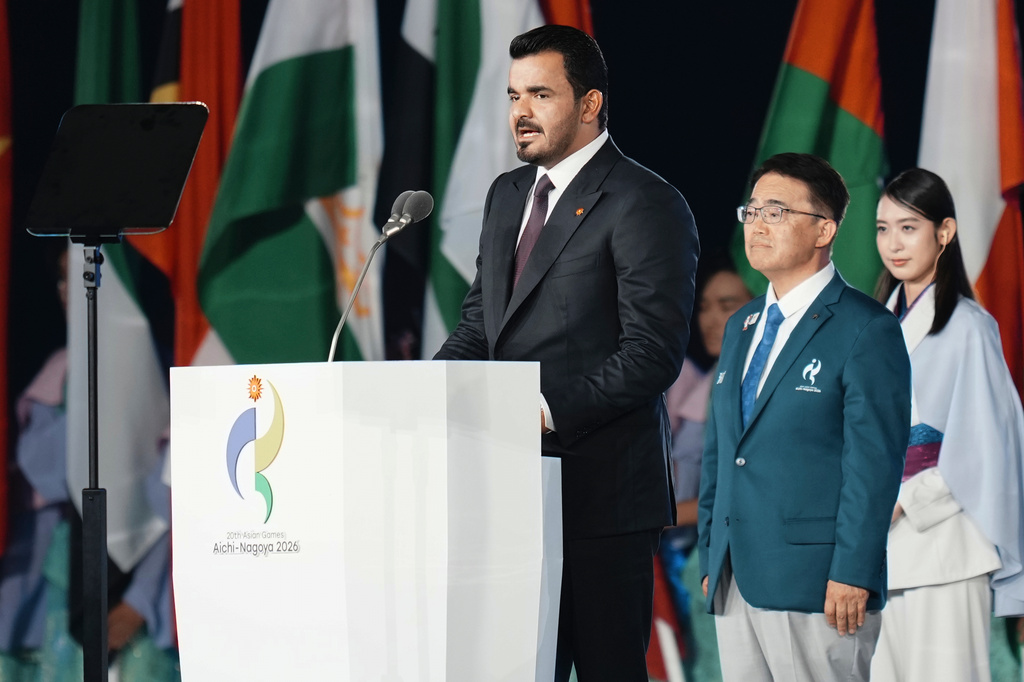 President of the Olympic Council of Asia, Sheikh Joaan bin Hamad bin Khalifa Al Thani, left, speaks as President of the Asian Games, Hideaki Ohmura watches during the opening ceremony for the Asian Games in Nagoya, Japan, Saturday, Sept. 19, 2026. (AP Photo/Lee Jin-man)