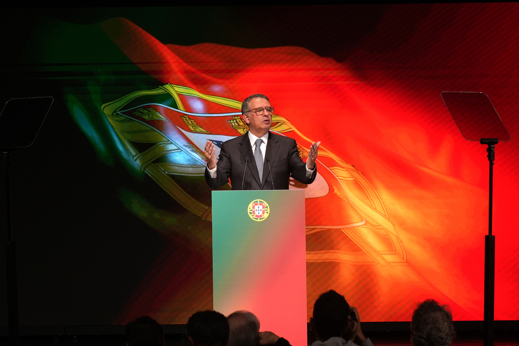 Center-left Socialist candidate António José Seguro talks after defeating far-right populist André Ventura in the second round of Portugal's presidential election in Lisbon, Sunday, Feb. 8, 2026. (AP Photo/Ana Brigida)