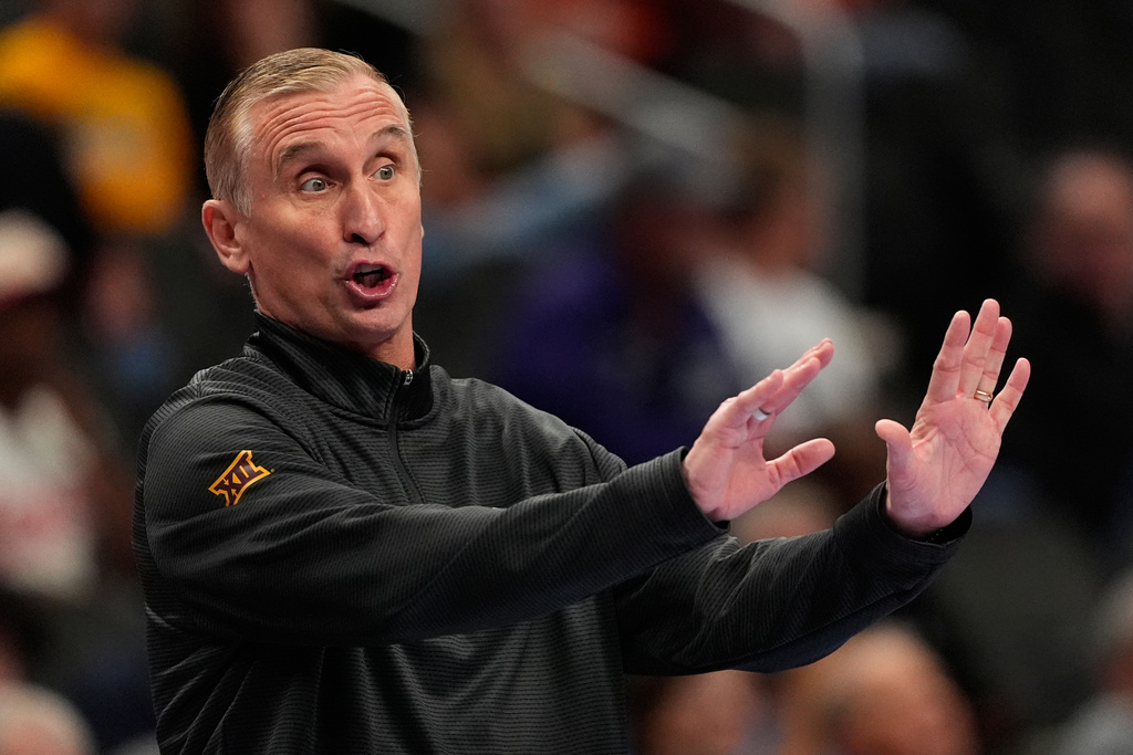 Arizona State head coach Bobby Hurley motions to his players during the first half of an NCAA college basketball game against Baylor at the Big 12 Conference tournament Tuesday, March 10, 2026, in Kansas City, Mo. (AP Photo/Charlie Riedel)