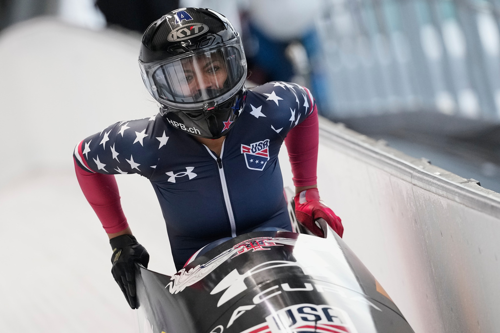 Winner Kaysha Love of the United States celebrates after the women's monobob race at the Bobsleigh World Cup in Innsbruck, Austria, Saturday, Nov. 29, 2025. (AP Photo/Matthias Schrader)