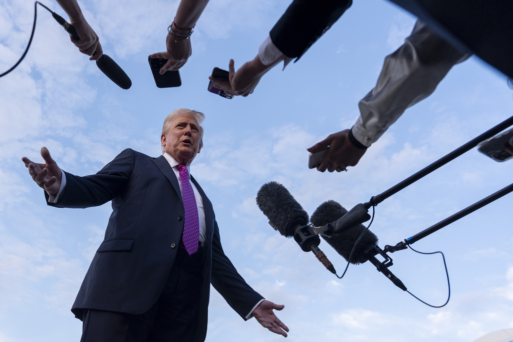 President Donald Trump speaks with reporters before he departs on Air Force One at Morristown Airport, Sunday, Sept. 14, 2025, in Morristown, N.J. (AP Photo/Alex Brandon)