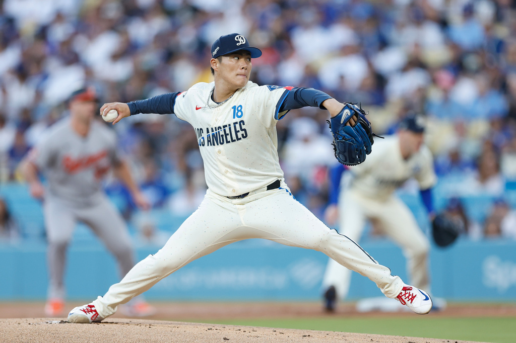 Los Angeles Dodgers starting pitcher Yoshinobu Yamamoto (18) throws during the first inning of a baseball game against the Baltimore Orioles, Saturday, June 20, 2026, in Los Angeles. (AP Photo/Caroline Brehman)
