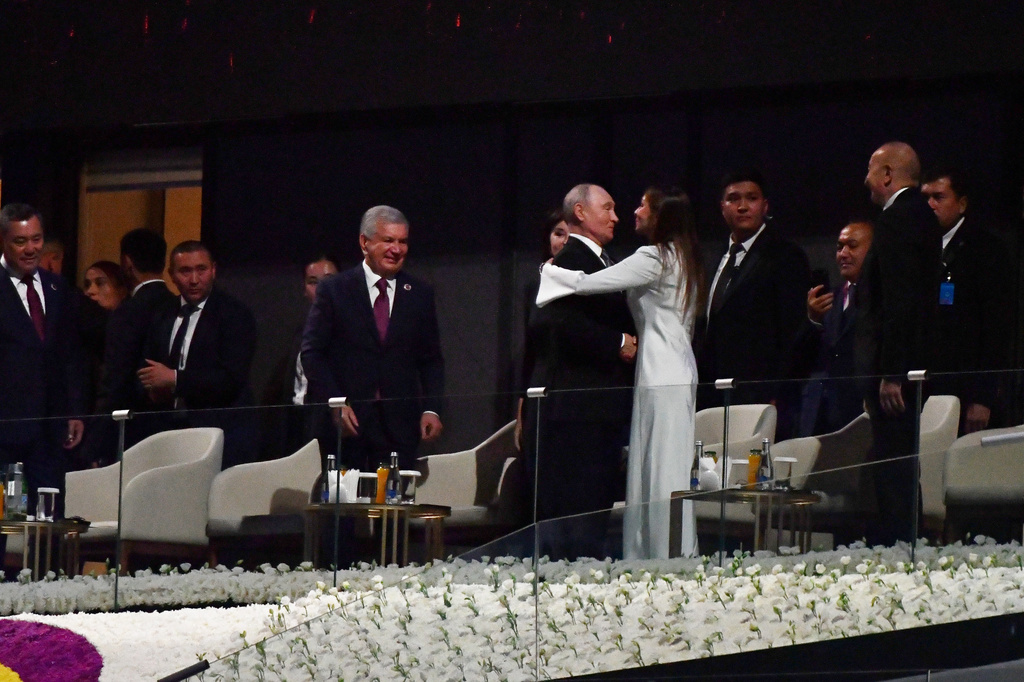 Russian President Vladimir Putin, center right, and Azerbaijan's President Ilham Aliyev's wife Mehriban Aliyeva, greet each other as Azerbaijan's President Ilham Aliyev, second right, and leaders of the Shanghai Cooperation Organization (SCO) gather to watch the opening ceremony of the World Nomad Games, in Bishkek, Kyrgyzstan, on Monday, Aug. 31, 2026. (AP Photo/Vladimir Voronin)