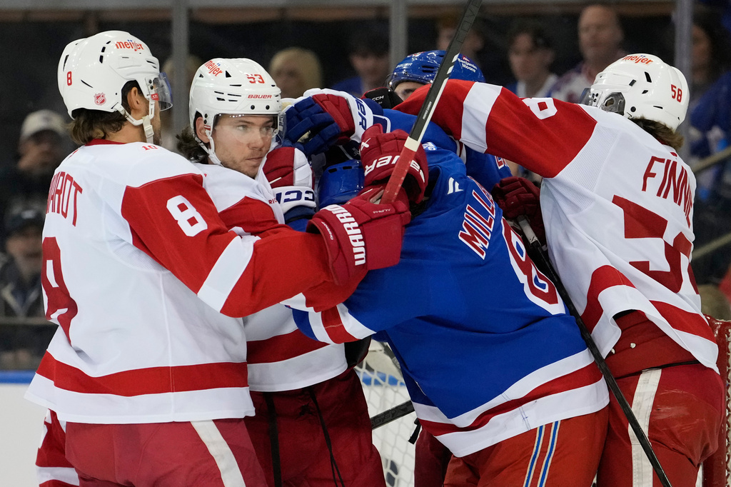 Detroit Red Wings defenseman Moritz Seider (53) fights with New York Rangers center J.T. Miller (8) during the first period of an NHL hockey game, Saturday, April 4, 2026, in New York. (AP Photo/Yuki Iwamura)