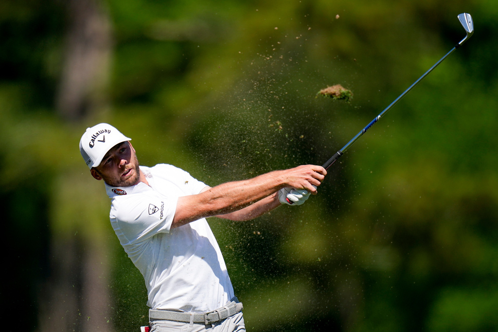 Sam Burns watches his tee shot on the 12th hole during the second round of the Masters golf tournament at the Augusta National Golf Club, Friday, April 10, 2026, in Augusta, Ga. (AP Photo/Eric Gay)