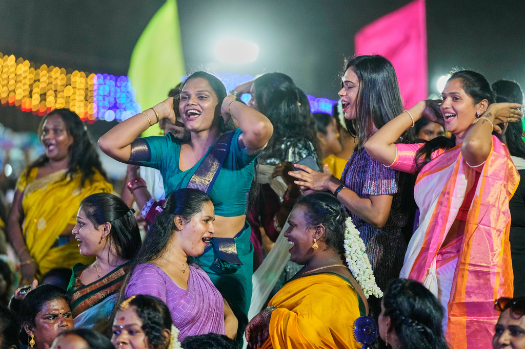 Transgender participants dance during the Miss Koovagam 2026 beauty pageant at the Koovagam festival in Villupuram, India, Monday, April 27, 2026. (AP Photo/Mahesh Kumar A.)