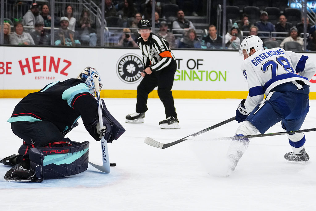 Seattle Kraken goaltender Philipp Grubauer makes a save against Tampa Bay Lightning center Zemgus Girgensons (28) during the second period of an NHL hockey game Tuesday, March 17, 2026, in Seattle. (AP Photo/Lindsey Wasson)
