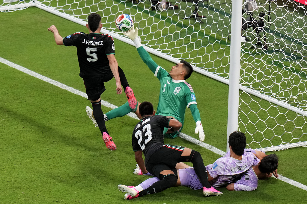 Mexico goalkeeper Raul Rangel, middle, reaches to stop the ball during the World Cup Group A soccer match between Mexico and South Korea in Zapopan, near Guadalajara, Mexico, Thursday, June 18, 2026. (AP Photo/Silvia Izquierdo)