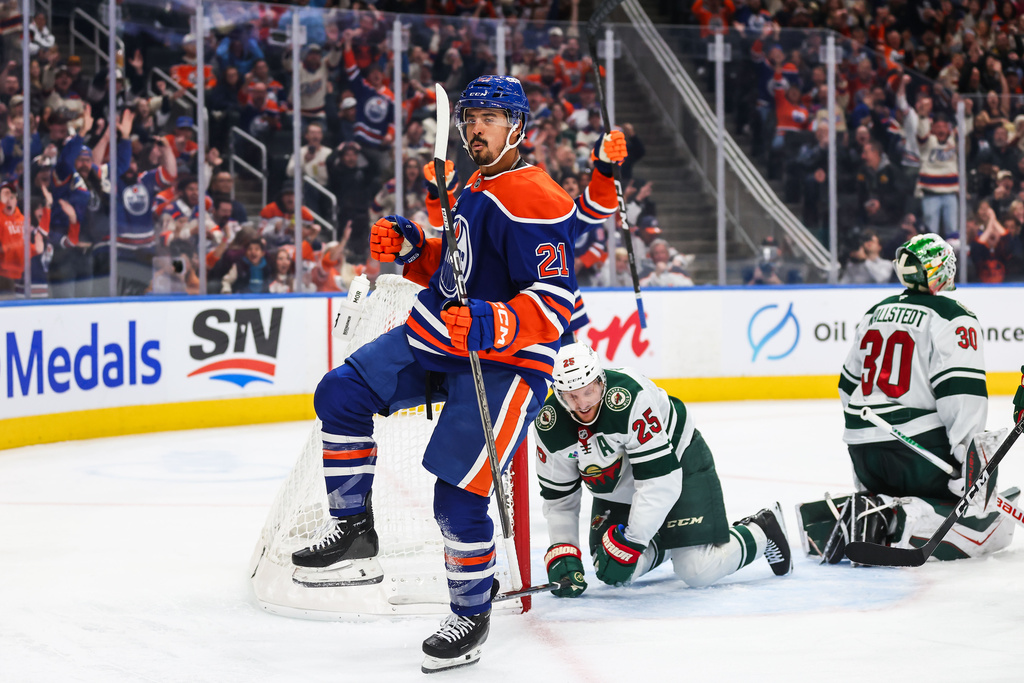 Edmonton Oilers' Mathieu Joseph (21) celebrates a goal against the Minnesota Wild during during the second period of an NHL hockey game in Edmonton, Tuesday, Oct. 20, 2026. (Codie McLachlan/The Canadian Press via AP)