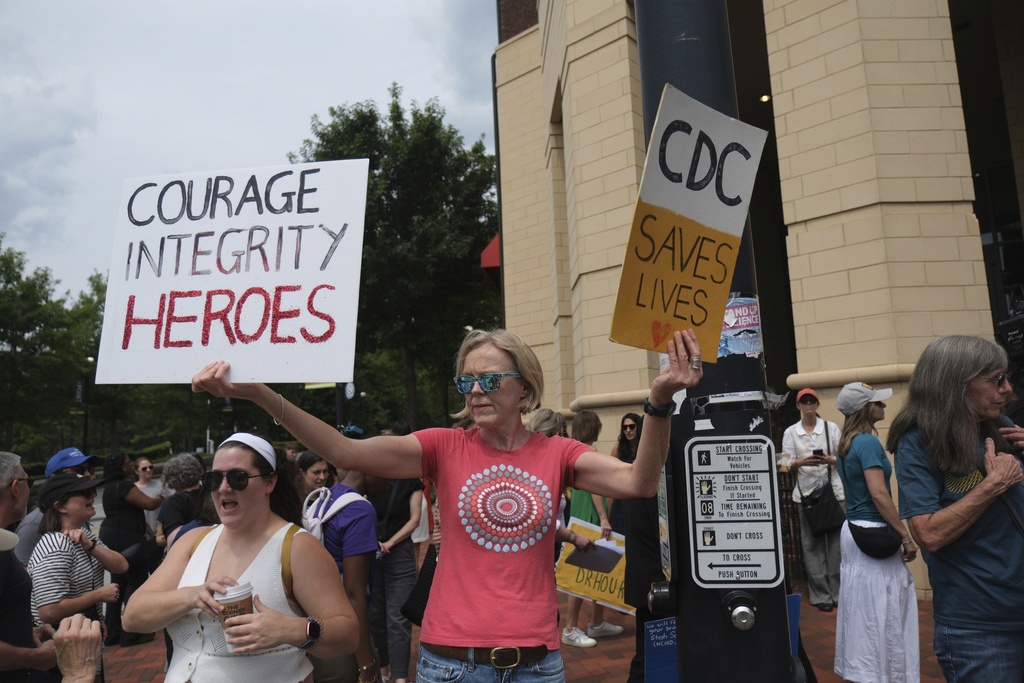 Workers and supporters gather to rally for the departing scientific leaders at the Centers for Disease Control and Prevention outside the CDC headquarters, Thursday, Aug. 28, 2025, in Atlanta. (AP Photo/Ben Gray)