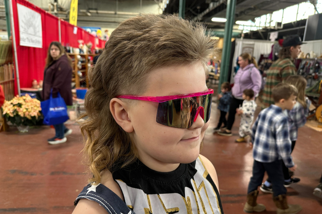 Mikey "The Mullet" Nelson, an 8-year old-contestant in a mullet hairstyle contest, gets ready for competition, Monday, Jan. 12, 2026 in Harrisburg, Pa. (AP Photo/Tassanee Vejpongsa)