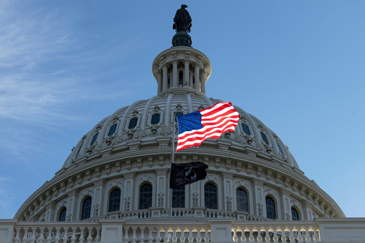 The American flag over the Capitol is illuminated by the early morning light on the first day of a government shutdown, in Washington, Wednesday, Oct. 1, 2025. (AP Photo/J. Scott Applewhite) The American flag over the Capitol is illuminated by the early morning light on the first day of a government shutdown, in Washington, Wednesday, Oct. 1, 2025. (AP Photo/J. Scott Applewhite)