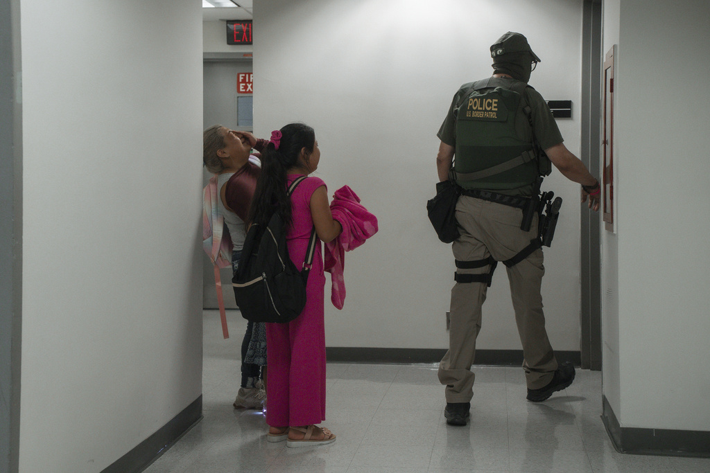 The wife and daughters of an asylum seeker from Ecuador cry after he was detained in immigration court, Thursday. July 31, 2025, in New York. (AP Photo/Olga Fedorova)