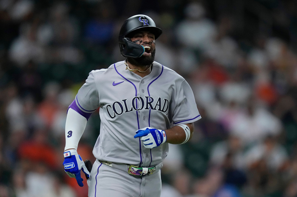 Colorado Rockies' Willi Castro reacts after being hit on the hand by a pitch during the fourth inning of a baseball game against the Houston Astros, Wednesday, April 15, 2026, in Houston. (AP Photo/Kevin M. Cox)