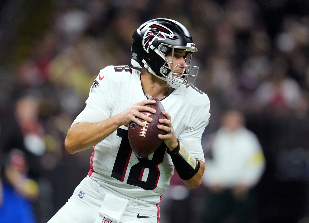 Atlanta Falcons quarterback Kirk Cousins drops back to pass against the New Orleans Saints in the first half of an NFL football game, Sunday, Nov. 23, 2025, in New Orleans. (AP Photo/Gerald Herbert)