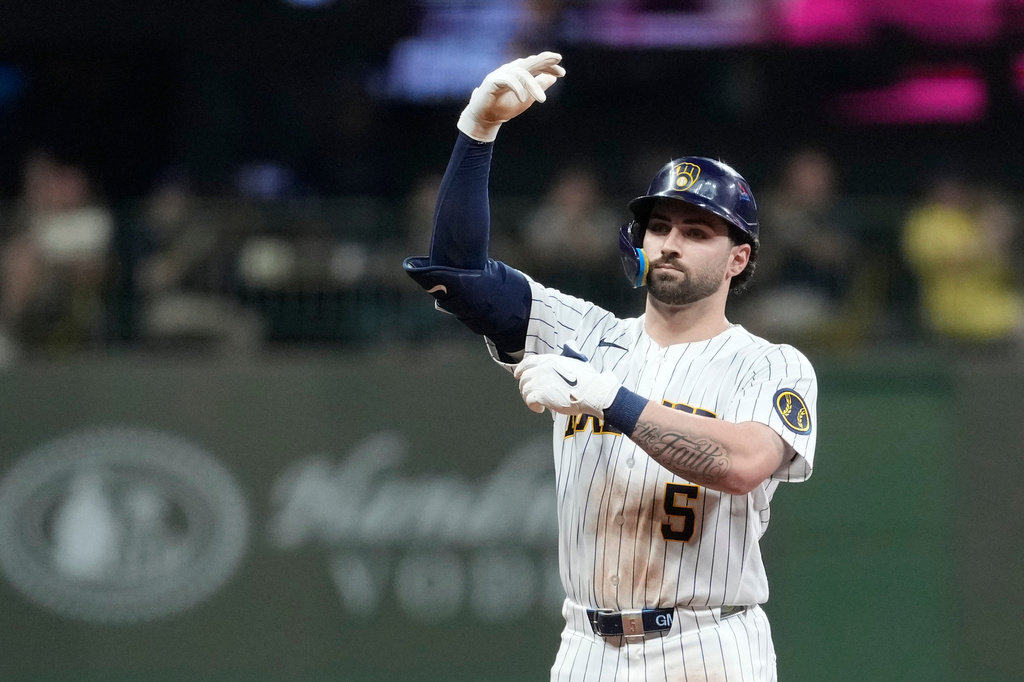 Milwaukee Brewers' Garrett Mitchell gestures after hitting a two-run double during the fifth inning of a baseball game against the Cincinnati Reds, Saturday, Sept. 12, 2026, in Milwaukee. (AP Photo/Aaron Gash)