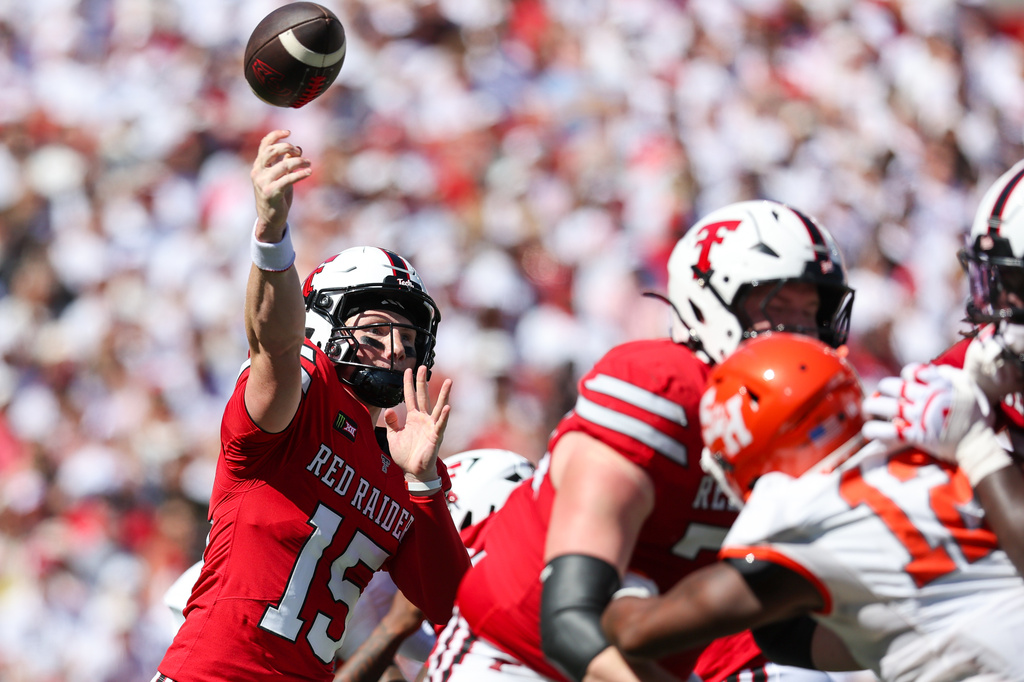 Romaine has 2 quick pick-6s as No. 11 Texas Tech beats Sam Houston 49-14 for 11th home win in row