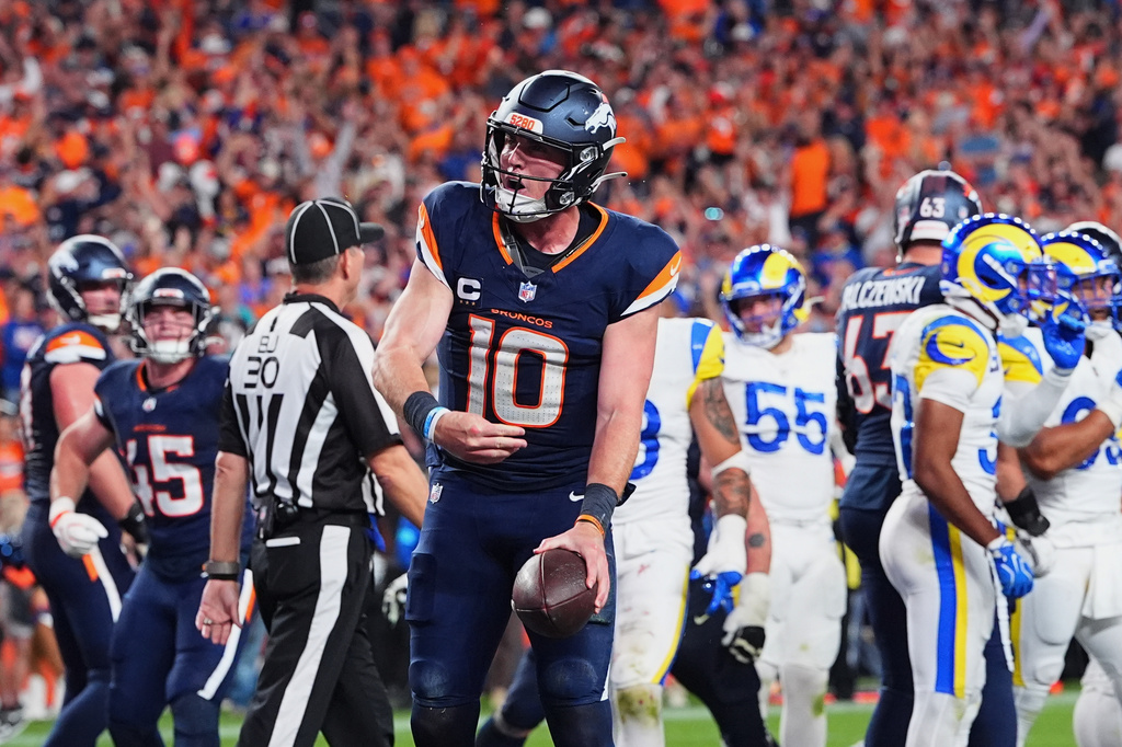 Denver Broncos quarterback Bo Nix reacts after scoring a touchdown against the Los Angeles Rams during the second half of an NFL football game Sunday, Sept. 27, 2026, in Denver. (AP Photo/David Zalubowski)