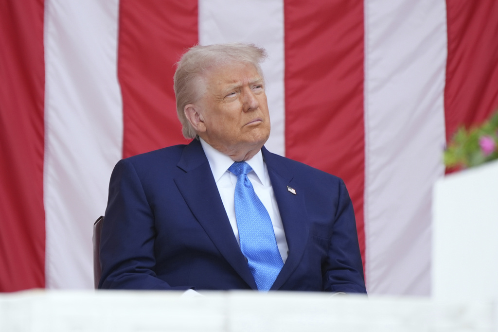 President Donald Trump listens during the 157th National Memorial Day Observance at Arlington National Cemetery, Monday, May 26, 2025, in Arlington, Va. (AP Photo/Jacquelyn Martin)