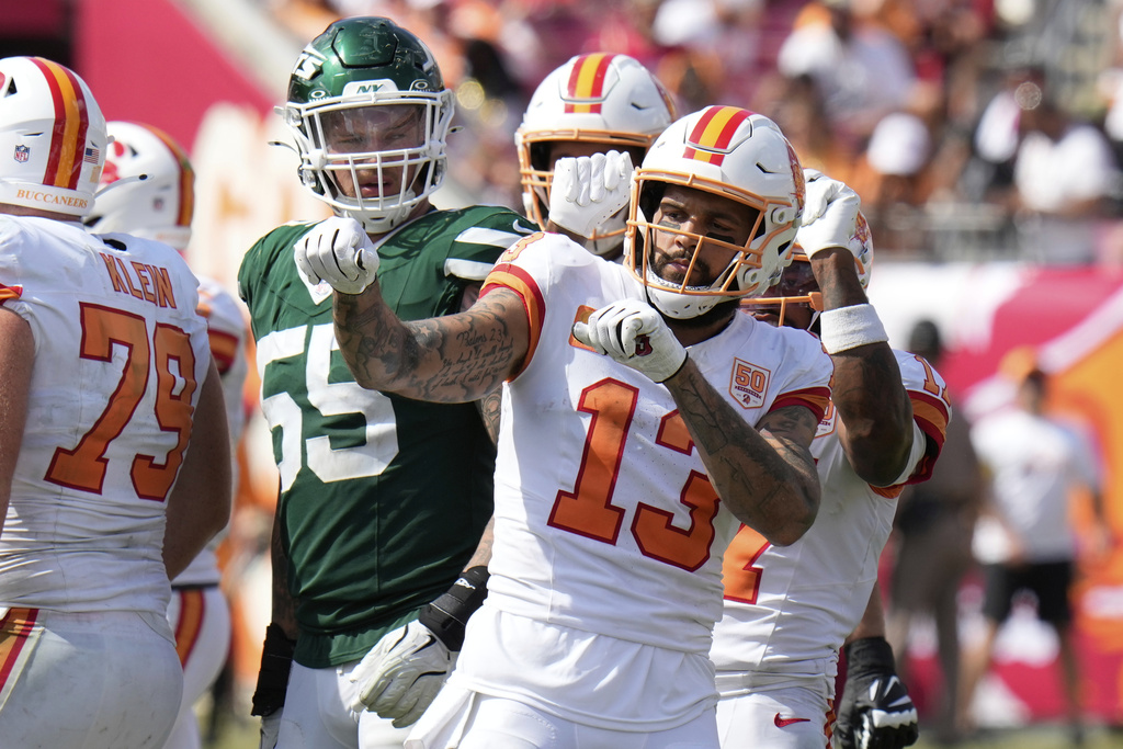 Tampa Bay Buccaneers wide receiver Mike Evans (13) celebrates a first down catch during the second half of an NFL football game against the New York Jets Sunday, Sept. 21, 2025, in Tampa, Fla. (AP Photo/Chris O'Meara)
