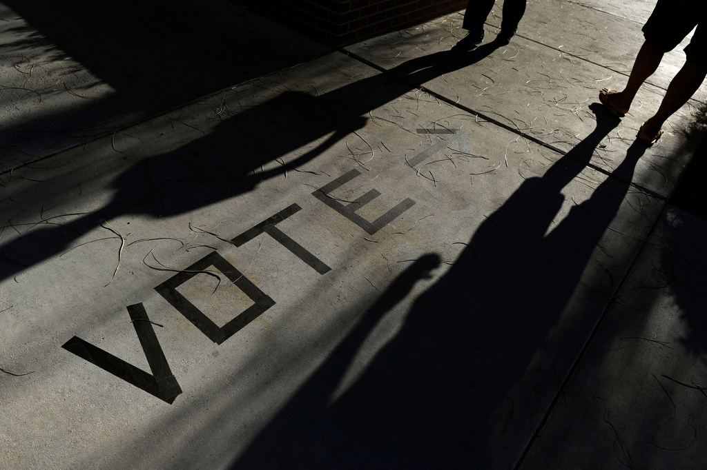 FILE - Voters head to the polls at the Enterprise Library in Las Vegas, Nov. 6, 2018. (AP Photo/Joe Buglewicz, File)