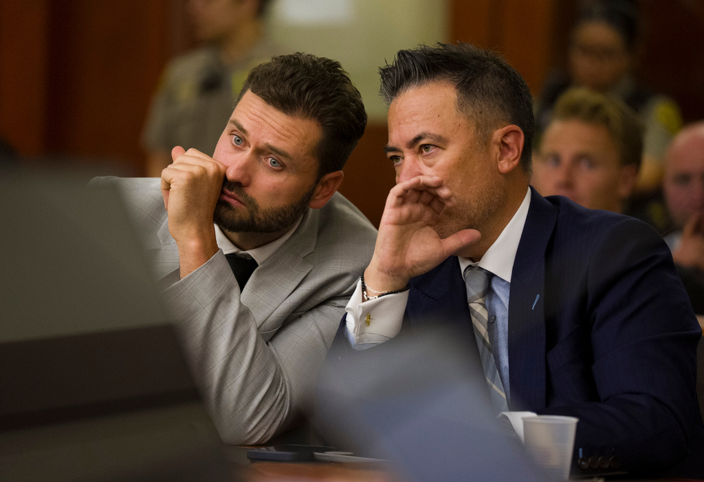 Dakota Mortensen, left, speaks with his attorney Joel Kittrell in Third District Court for a hearing regarding protective orders in Salt Lake City on Thursday, April 30, 2026. (Bethany Baker/The Salt Lake Tribune via AP, Pool)