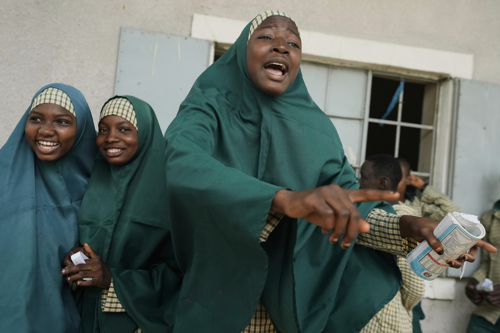 Students of the Future Prowess Islamic Foundation School gesture as they watch a soccer game during break time, in Maiduguri, Nigeria, Thursday, July 24, 2025. (AP Photo/Sunday Alamba)