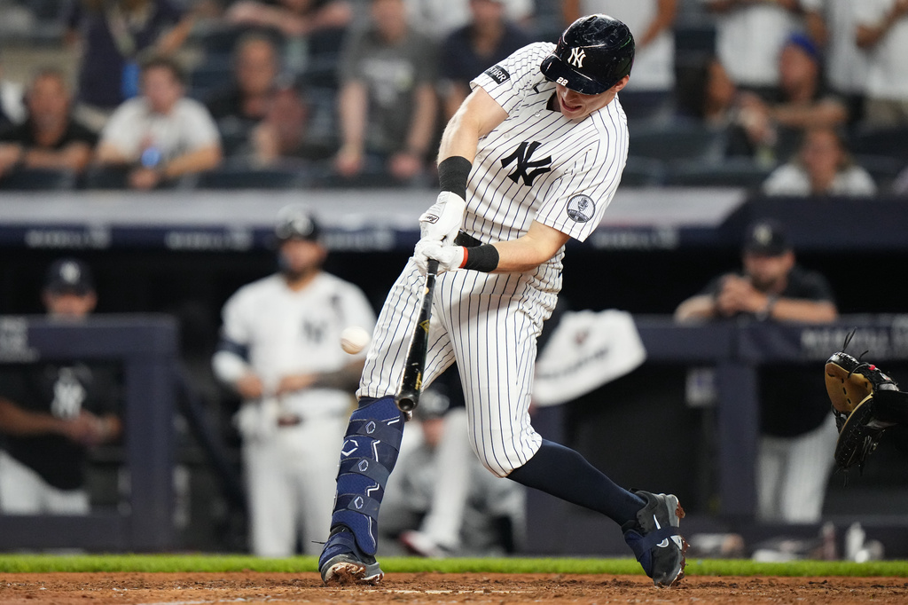 New York Yankees' Ben Rice hits an RBI single during the ninth inning of a baseball game against the Atlanta Braves Friday, Aug. 7, 2026, in New York. (AP Photo/Frank Franklin II)