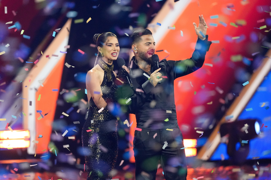 Hosts Roselyn Sanchez and Maluma appear on stage at the conclusion of the 2025 Latin Grammys on Thursday, Nov. 13, 2025, at MGM Grand in Las Vegas. (AP Photo/Chris Pizzello)