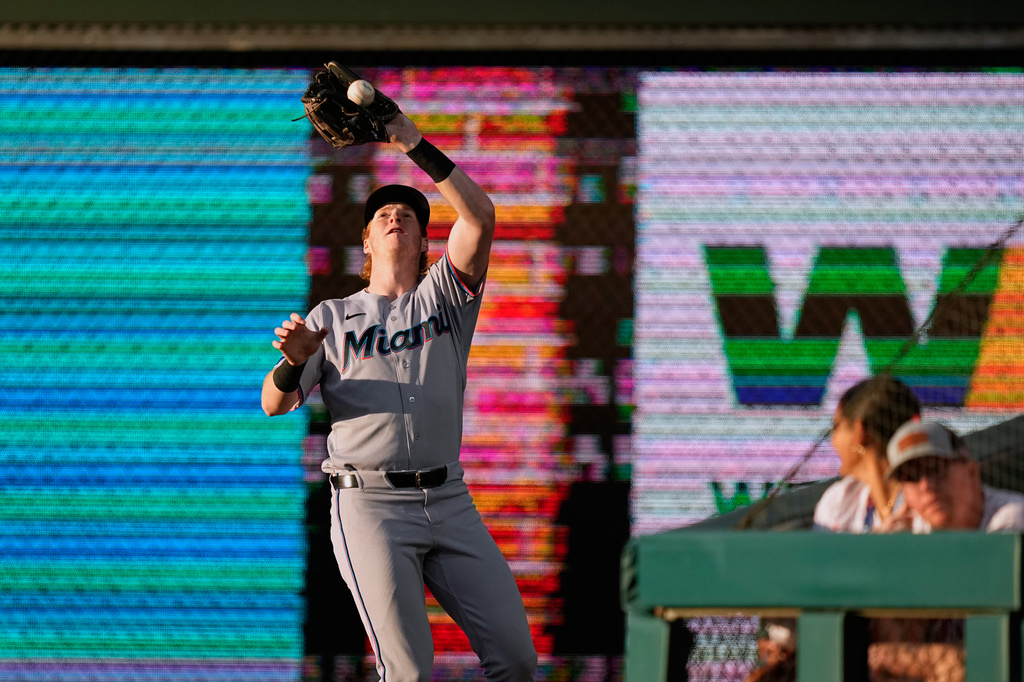 Miami Marlins right fielder Owen Caissie catches a fly out by Philadelphia Phillies' Edmundo Sosa during the third inning of a baseball game Monday, June 15, 2026, in Philadelphia. (AP Photo/Matt Slocum)